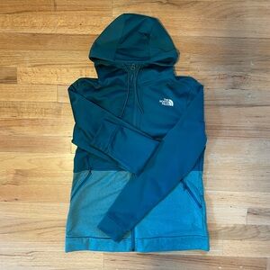Women’s North Face teal green zip-up hoodie.